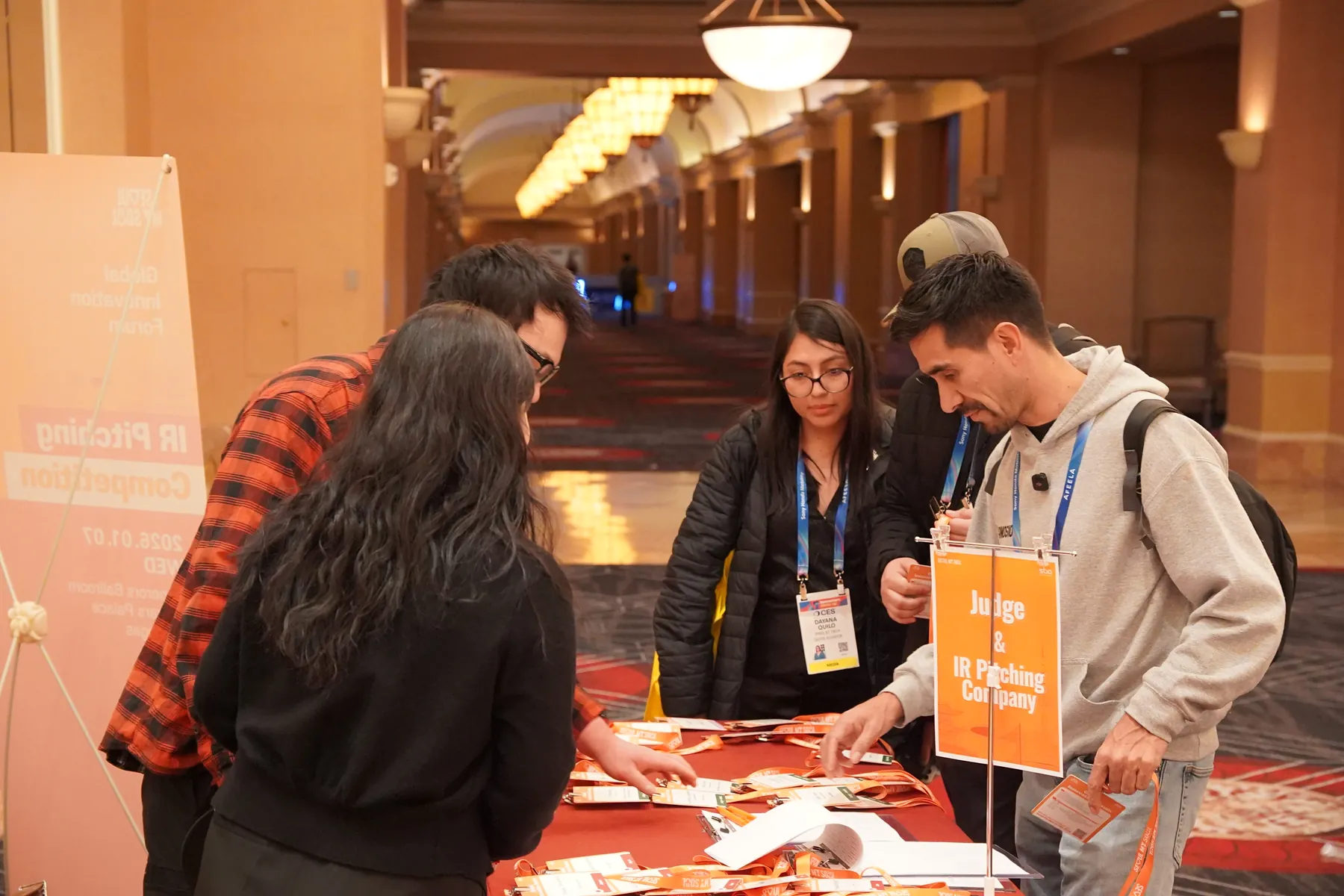 Founders and judges sign in at the forum registration desk