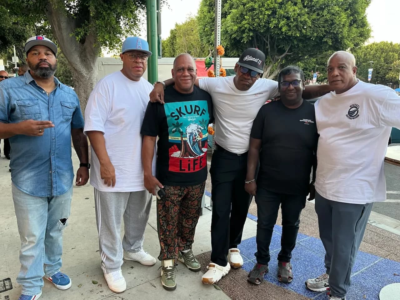 Guests gather outside on the sidewalk in Leimert Park